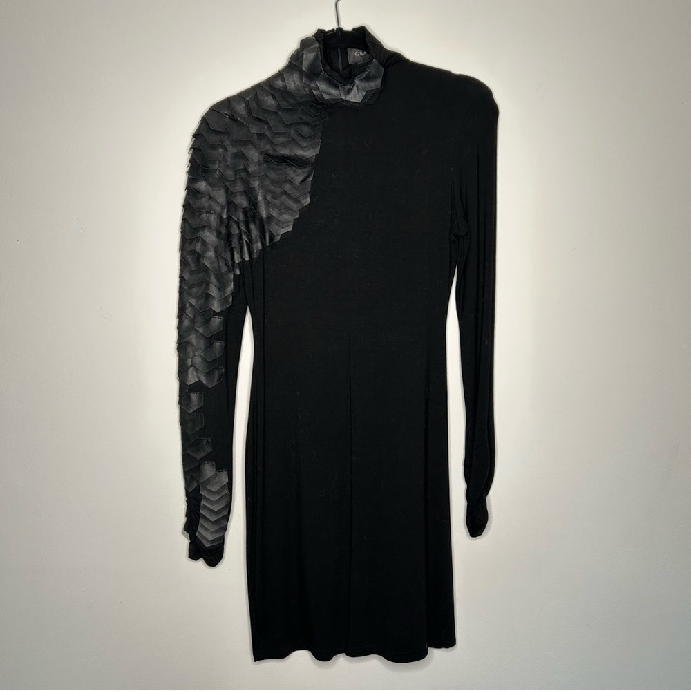 Unique black woman’s fitted dress with scalloped leather sleeve accent - M